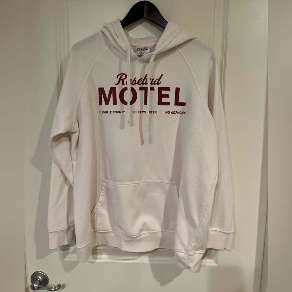 Schitts Creek cream Rosebud Hotel long sleeved sweatshirt.